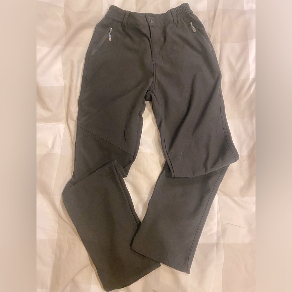 Outdoor fleece lined water resistant slacks tag is XL but run as a M-L (IMO)